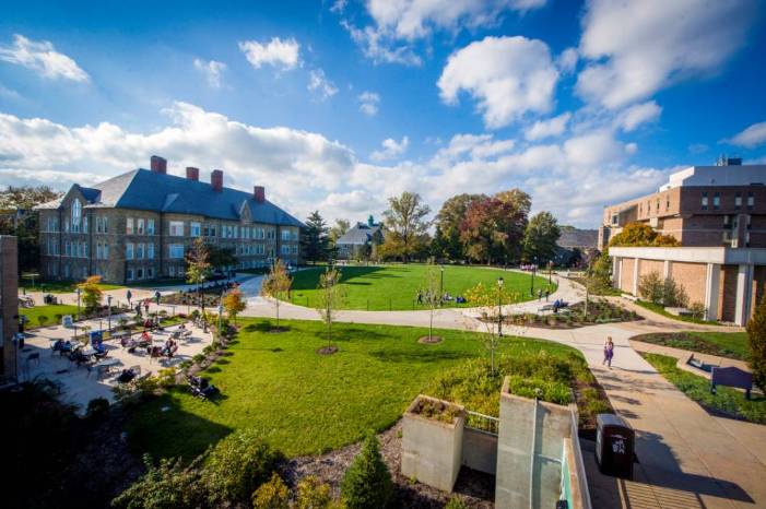 Aerial photo of the WCU Quad, a circle of grass with a circular path around it, framed by academic buildings.