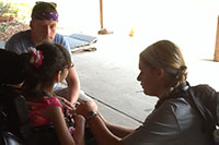 Students assisting a girl