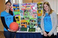 Students with a display on Camp Abilities