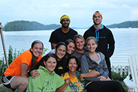 Group photo of students by a lake