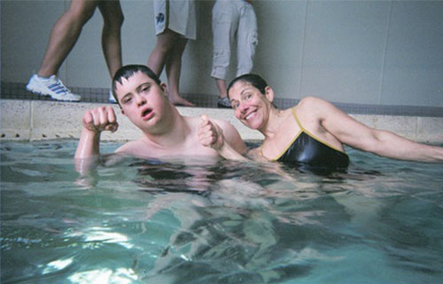 Dr. Lepore swimming with a boy