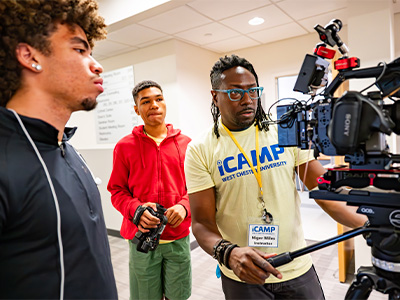 ICamp students work on camera equipment