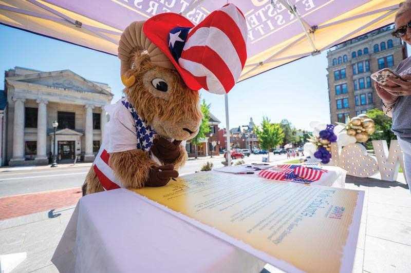 Rammy signs a pledge stating he’s ready to celebrate America’s 250th anniversary