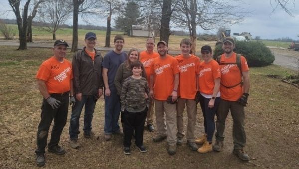 Pictured (L-R): Rich McLaughlin ’72, Gordon Eck, Ross, Jessica, and Lincoln Molle (the family being helped), Jim Depp, Ryan McLaughlin, Jake McLaughlin, Brigid Gallagher, and Matt Eck.