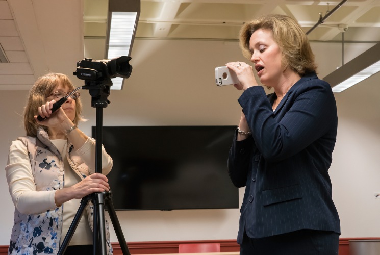 West Chester University Professor of Communication Sciences and Disorders Liz Grillo (pictured on the right) shows 6abc Action News HealthCheck Producer Dawn Heefner (pictured on the left) how to use the VoiceEvalU8 tool that Professor Grillo invented to help today’s teachers reduce debilitating voice disorders.