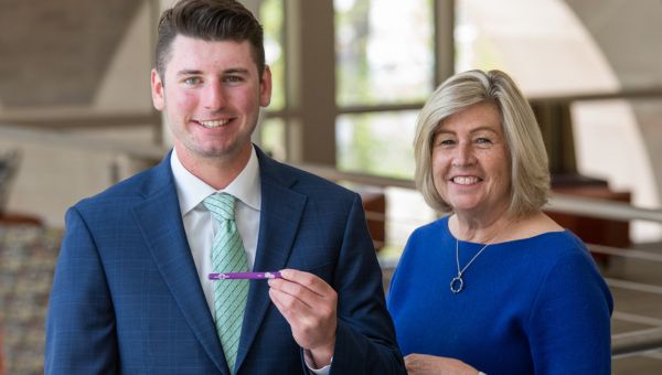 (l to r) Zach Starr, a West Chester University sophomore, holds his recently-launched invention — The Quix, a tobacco-free alternative to nicotine vaping. Starr is pictured with his mentor, Pattie Diggin, director of the University’s Cottrell Entrepreneurship Center.