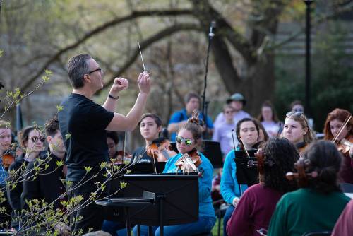 Conductor with wand in front of band