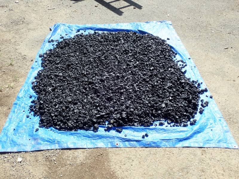 The char from a single burn drying on a top prior to being more finely ground