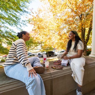 2 Women sitting down and having a lovely conversation
