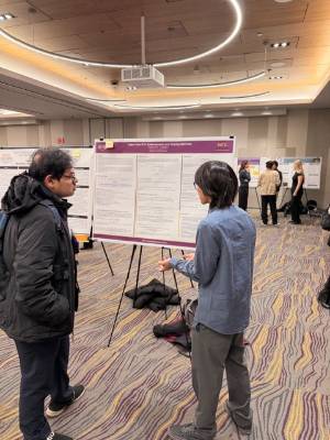 Sebastian Tran shows his research poster st the CSM Fall Poster Event