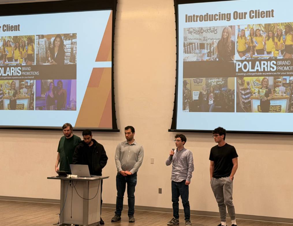 Students presenting on stage