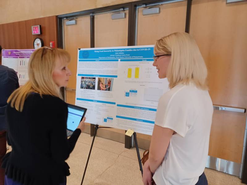Julia Zelinsky (undergraduate) with her poster.