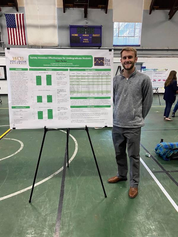 Evan Parker with his poster at CSM December 2022