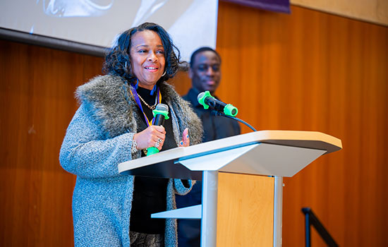 Guest speaker at podium of a The Society event