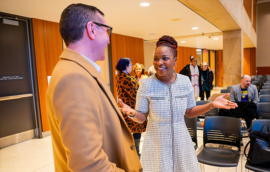 Male and female laughing in conversation