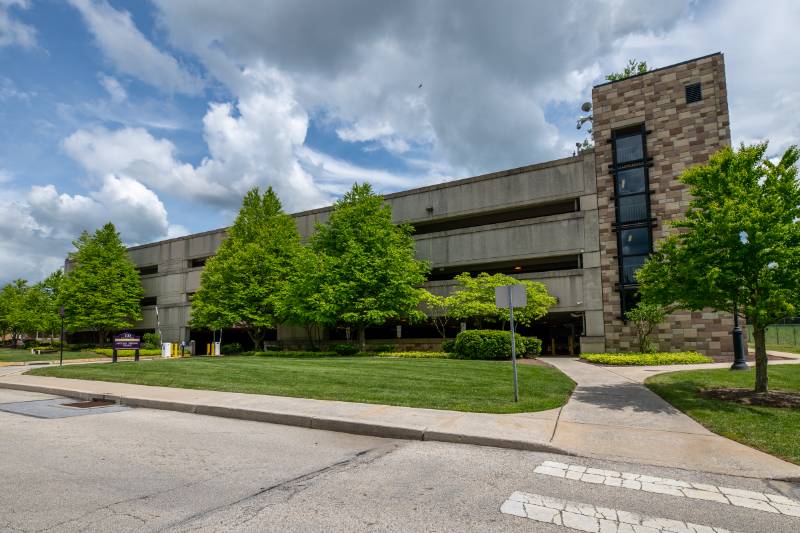 WCU's public safety building with two officers walking out the door