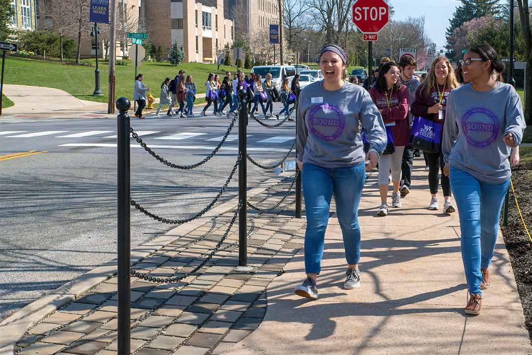 
						 WCu tour guides leading students across campus 
					